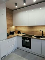 Corner kitchen with wooden countertop photo