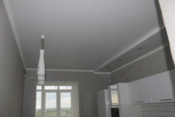 Design of a matte stretch ceiling in the kitchen photo