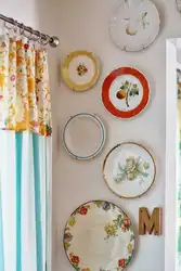 Plates in the kitchen in the interior photo