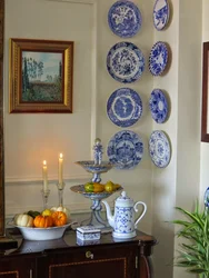 Decorative plates on the wall in the kitchen interior