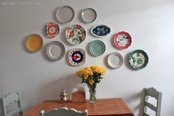 Decorative plates on the wall in the kitchen interior