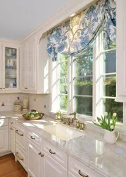 Kitchen design with a window in a classic style