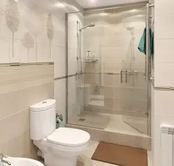 Bathroom interior with shower screen and washing machine