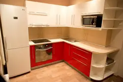 Bright corner kitchen with refrigerator photo