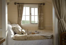 Double Bed By The Window In A Small Bedroom Photo