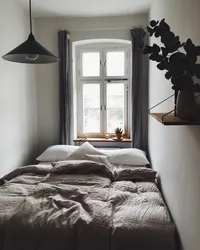 Double Bed By The Window In A Small Bedroom Photo