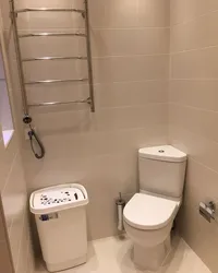 Toilet in the bathroom in the corner photo