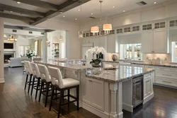 Kitchen with island in a country house design photo