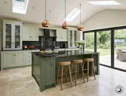 Kitchen with island in a country house design photo