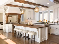 Kitchen with island in a country house design photo