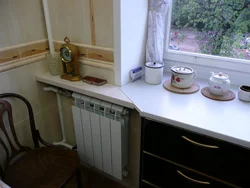 Cabinet in the window sill in the kitchen photo