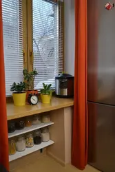 Cabinet In The Window Sill In The Kitchen Photo