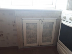 Cabinet in the window sill in the kitchen photo