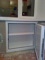 Cabinet in the window sill in the kitchen photo