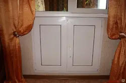 Cabinet in the window sill in the kitchen photo