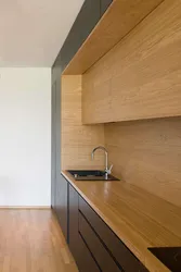 Photo Of A Kitchen With An Apron And A Wood-Look Countertop