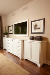 TV on the chest of drawers in the bedroom interior