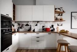 Bright kitchen with wooden countertop and apron in the interior