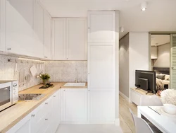 Bright kitchen with wooden countertop and apron in the interior