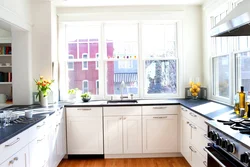 Kitchen set by the window photo in the apartment