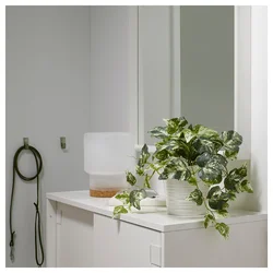 Artificial flowers in the bathroom interior