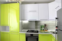 Kitchen design with a column and a refrigerator by the window