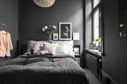 Dark gray walls in the bedroom interior