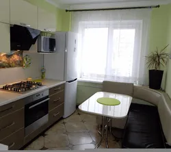 Kitchen design in Khrushchev with a sofa