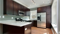 Dark brown floor in the kitchen interior