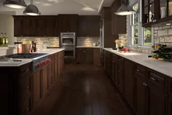 Dark brown floor in the kitchen interior