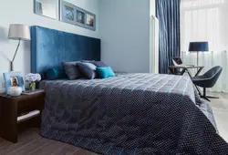 Blue bed in the bedroom interior