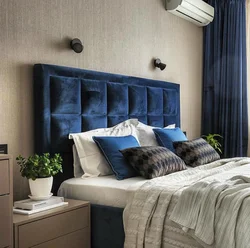 Blue bed in the bedroom interior