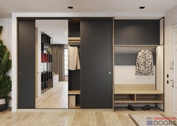 Built-in wardrobe along the entire wall in the hallway photo