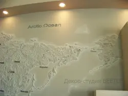 Plaster world map in the kitchen interior