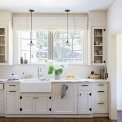 Kitchen design in a house with a window in the middle