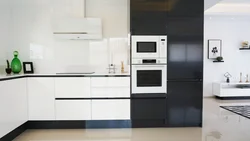 Photo of a kitchen with a black refrigerator photo