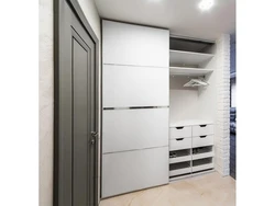 Sliding wardrobe in the hallway design white