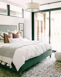 Green Bed In The Bedroom Interior