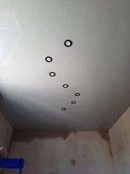 How to place lamps on a suspended ceiling photo in the bedroom