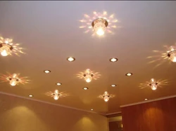 How to place lamps on a suspended ceiling photo in the bedroom