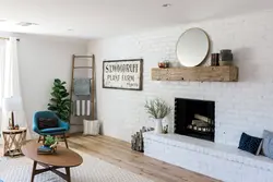 Combination of wallpaper and brick in the living room interior