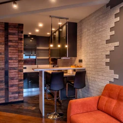 Combination of wallpaper and brick in the living room interior