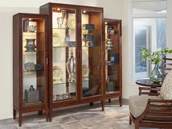 How to beautifully arrange dishes in a display case in the living room photo