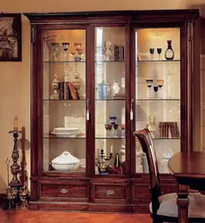 How to beautifully arrange dishes in a display case in the living room photo
