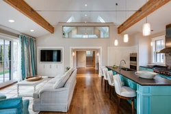 Design of a living room combined with a kitchen and access to the terrace