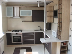Photos of corner kitchens with built-in appliances and counter