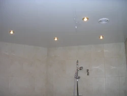 Suspended ceiling in the bathroom with a hood photo