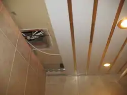 Suspended ceiling in the bathroom with a hood photo