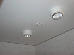 Suspended ceiling in the bathroom with a hood photo