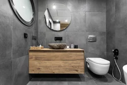 Photo of a bathtub made of concrete and wood tiles